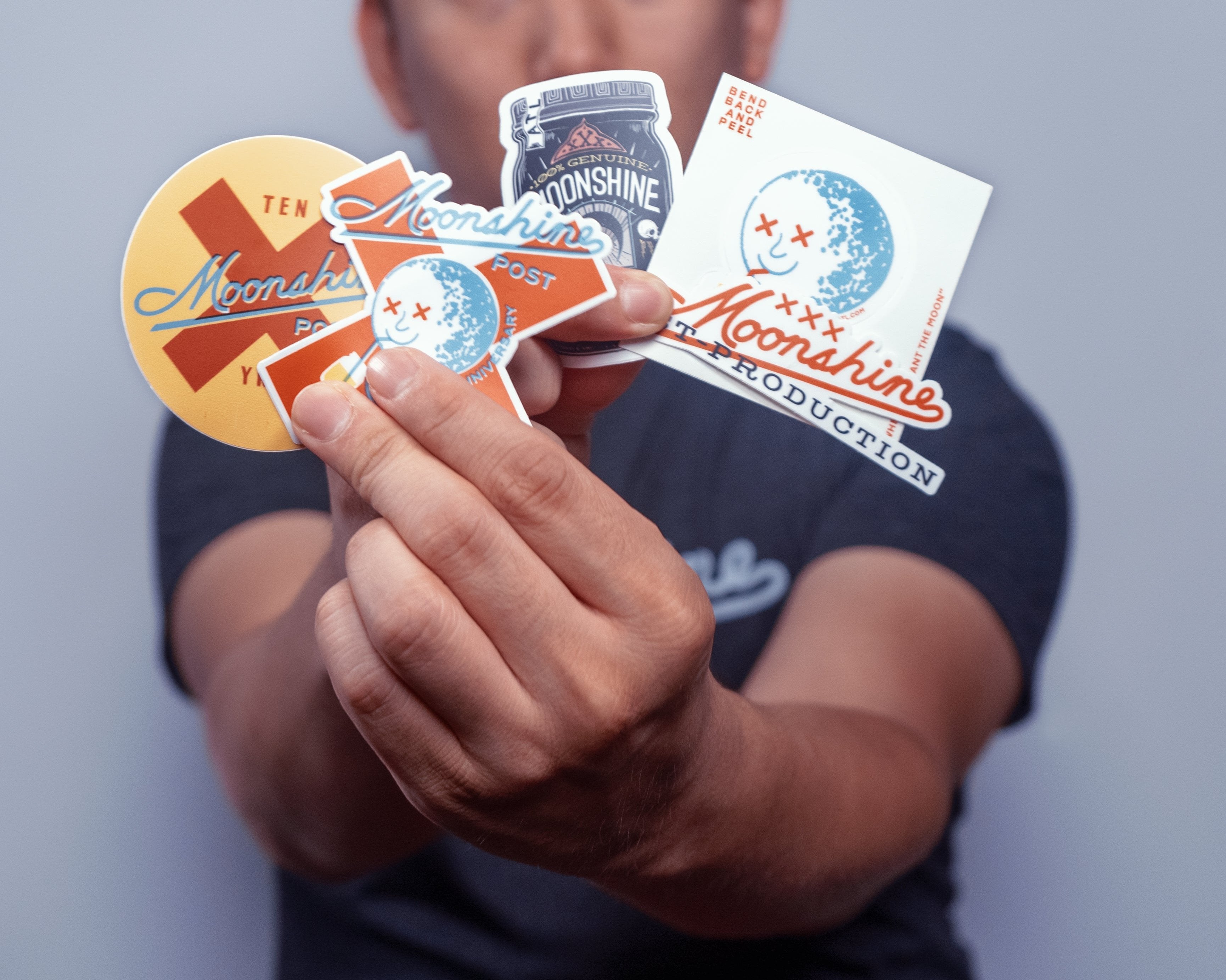 Model Holding Moonshine Stickers