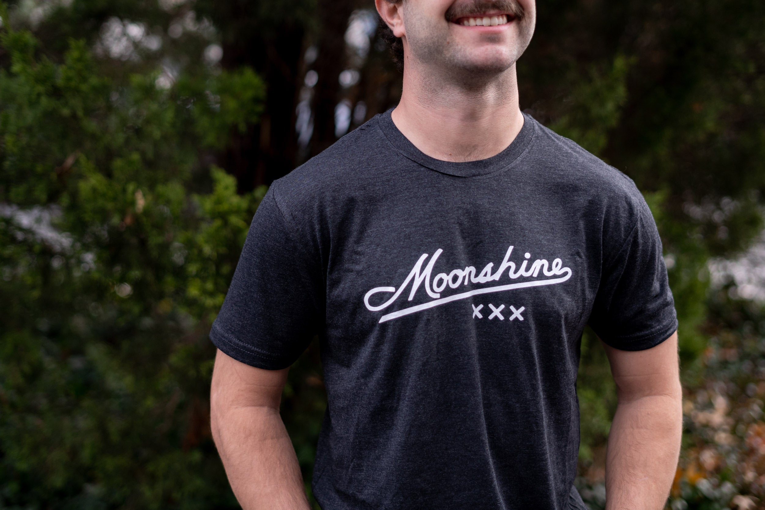 Man wearing a Slate Moonshine XXX T-Shirt