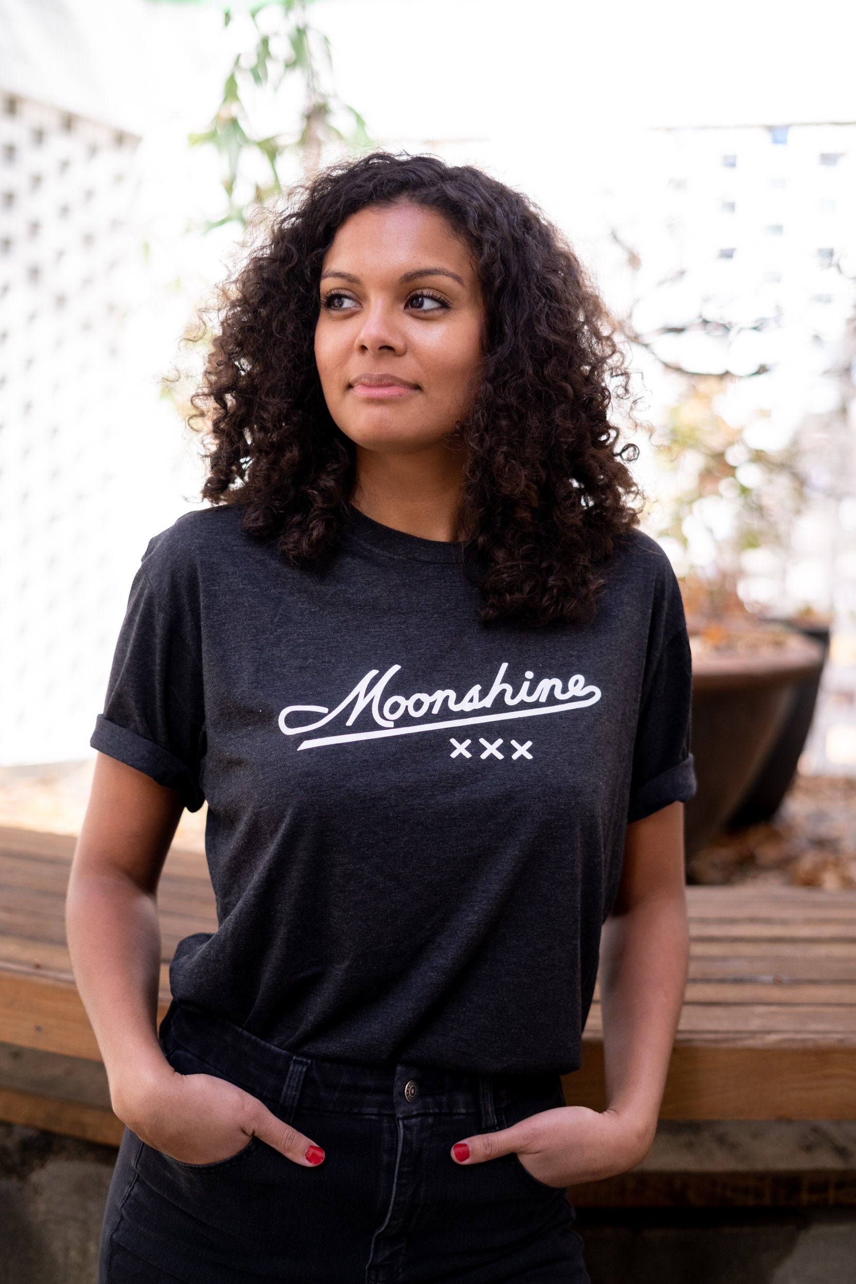 Woman wearing a Slate Moonshine XXX T-Shirt